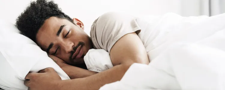 Woman sleeping peacefully with improved sleep quality from intermittent fasting