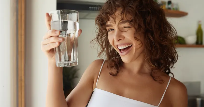 Woman celebrating happiness boost from intermittent fasting and improved mental health