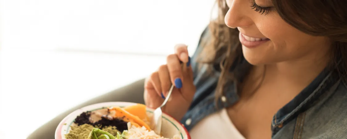 Woman tracking intermittent fasting progress and weight loss results with healthy lifestyle changes