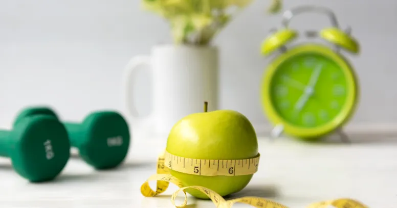 Measuring tape showing intermittent fasting benefits for weight loss and metabolic health