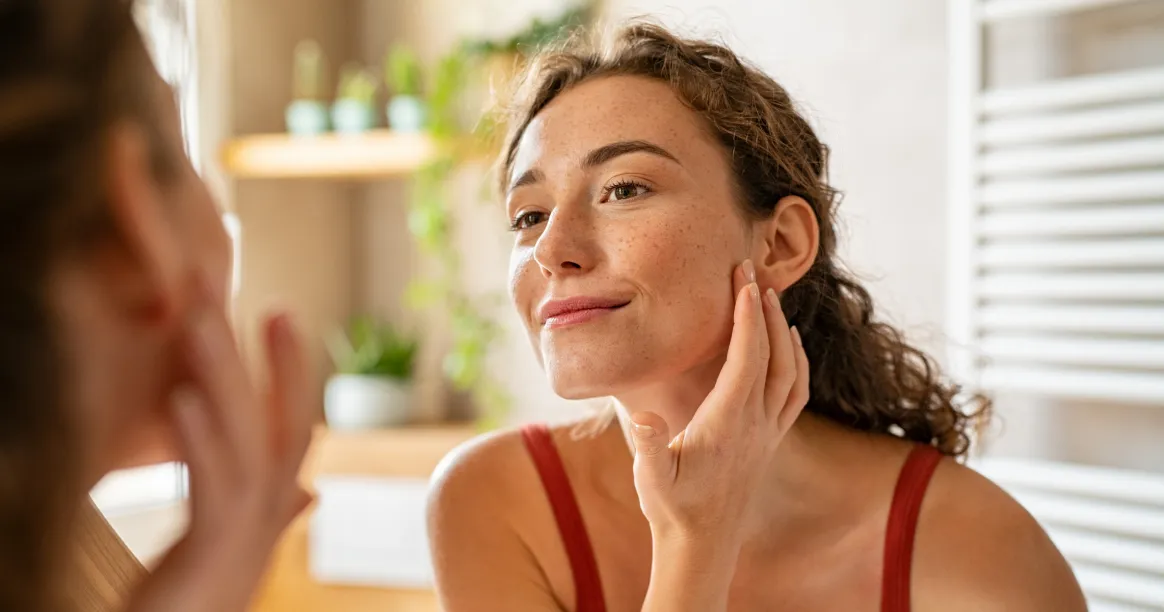 Woman with glowing skin practicing intermittent fasting for skin health benefits