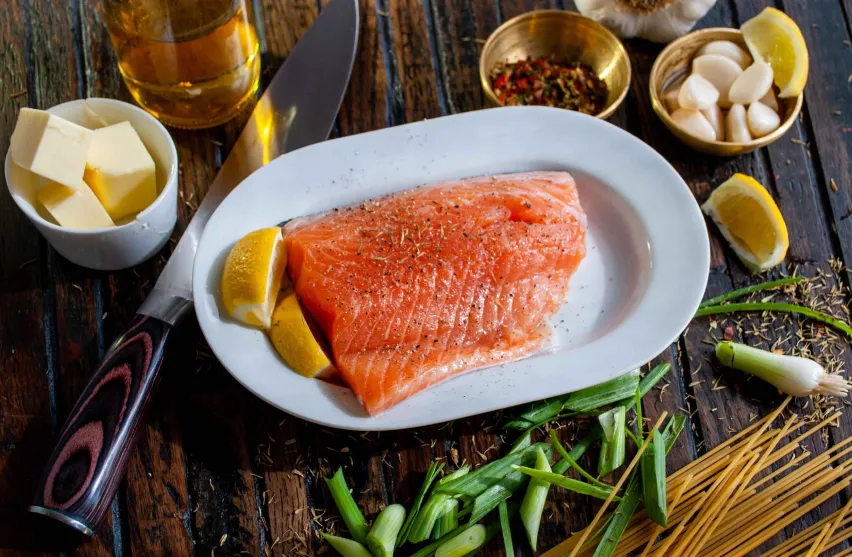 Salmon dinner with butter showing keto and intermittent fasting fat-burning benefits