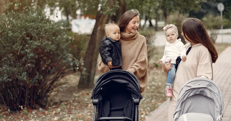 New mom with friends sharing postpartum weight loss tips and support