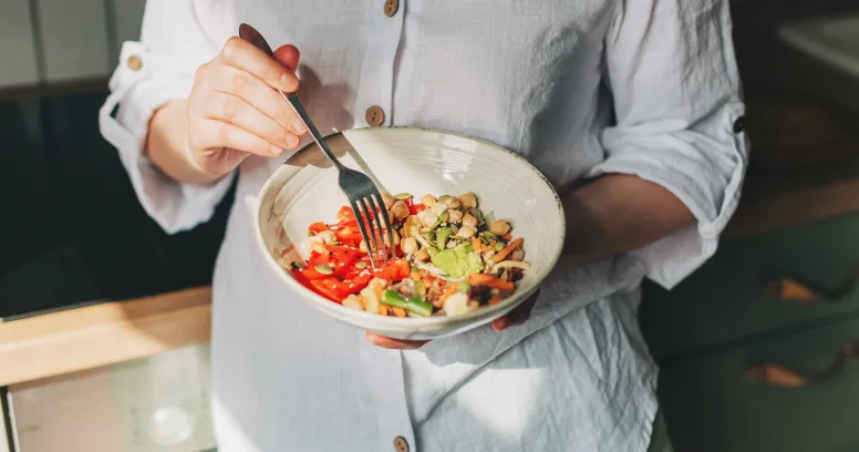 Woman eating mindfully without distractions for healthy weight loss and mindful eating habits